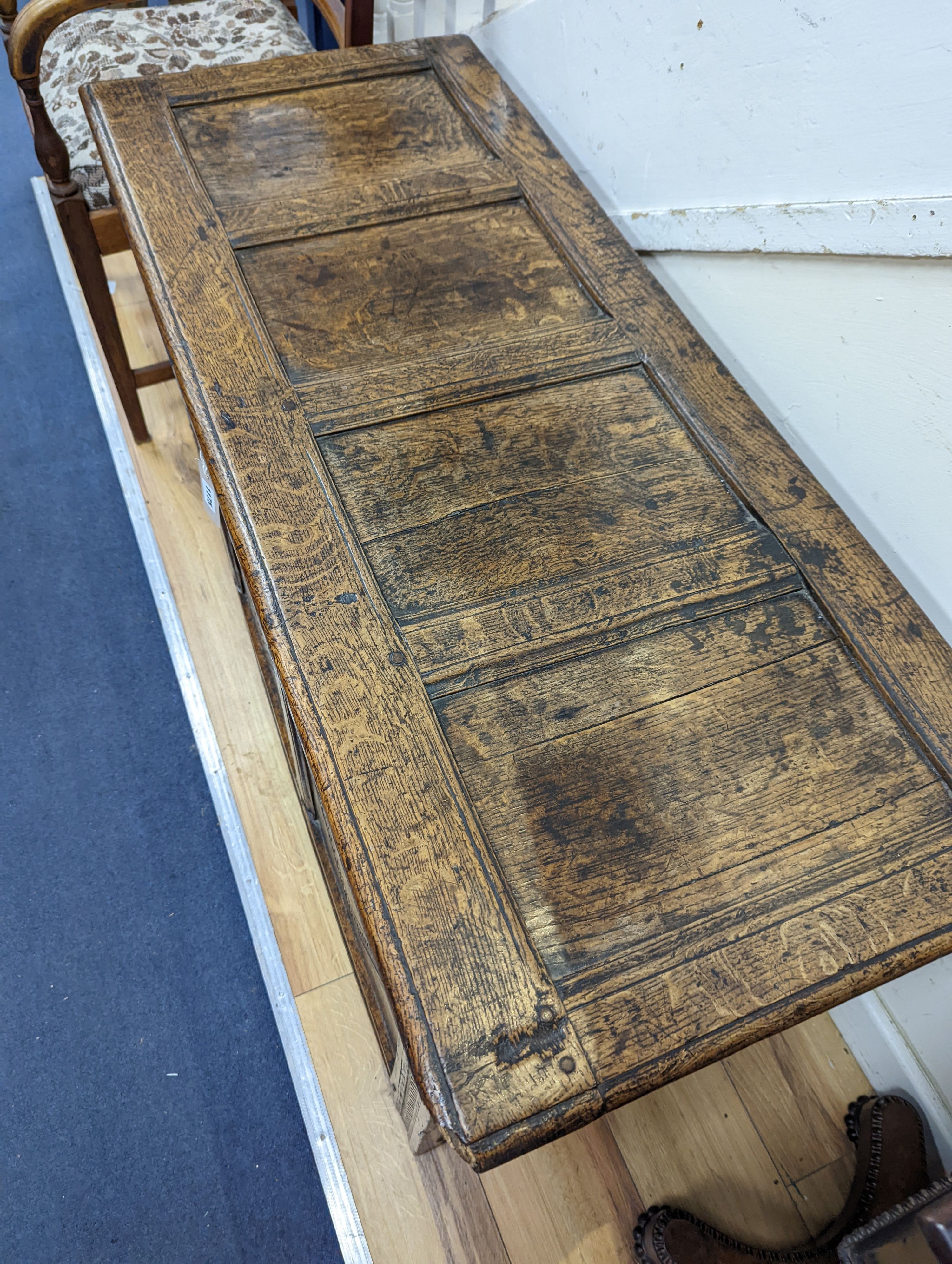 A 17th/18th century panelled oak coffer, length 122cm, depth 50cm, height 62cm